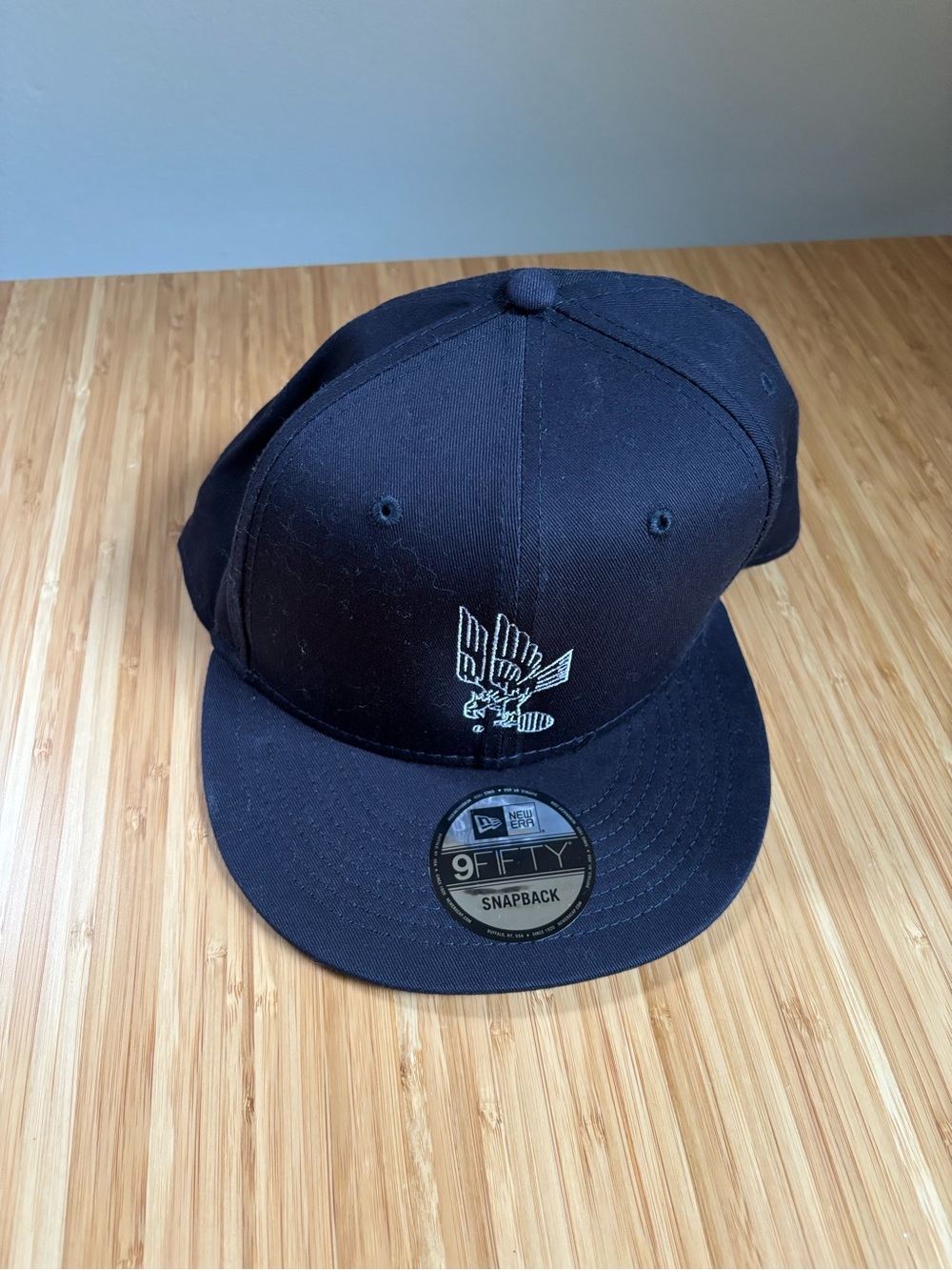 New Era Black Snapback Hat with White Eagle Patch